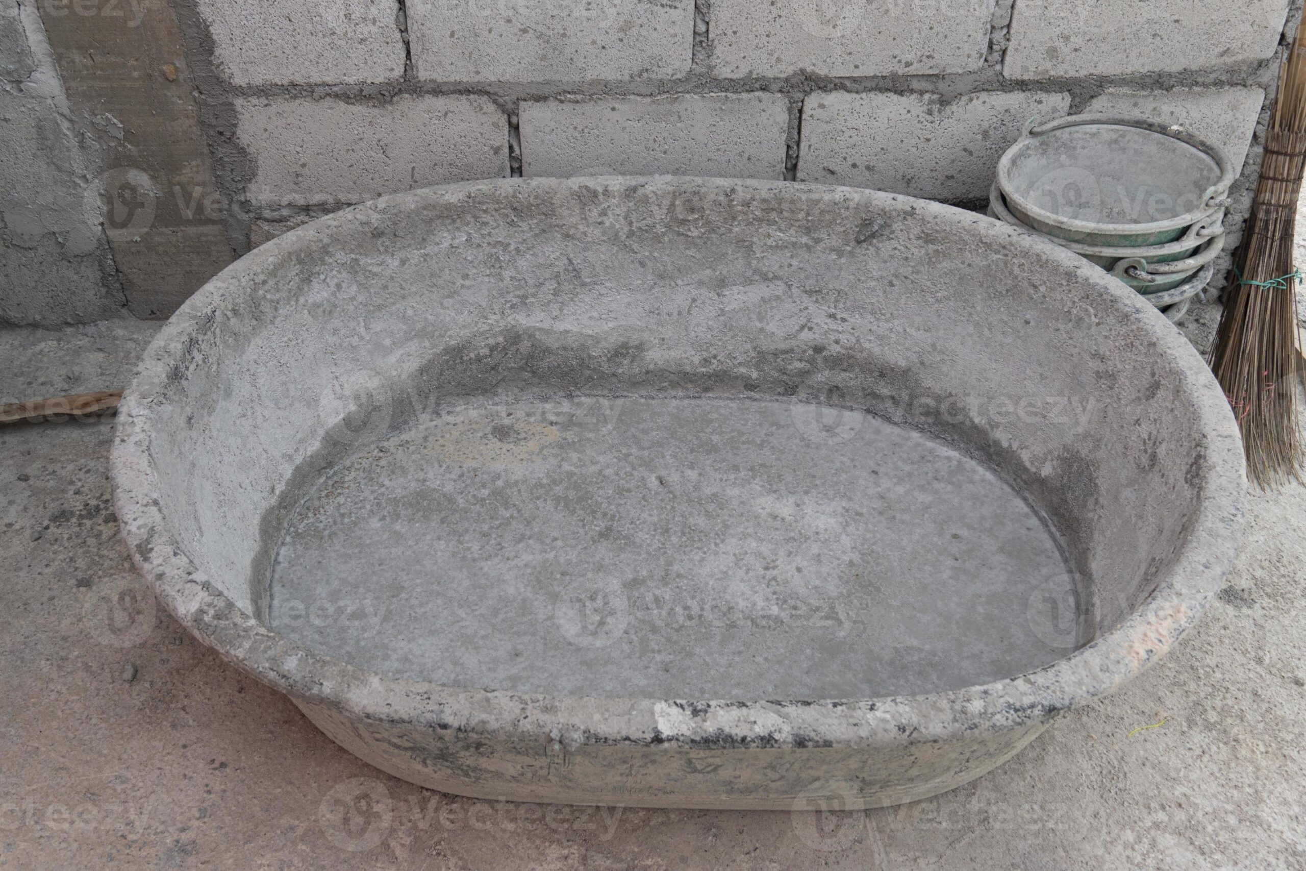Pre-wet puff concrete containers before filling them with fresh mortar